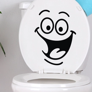 Close-up of smile face toilet lid sticker with black line art and waterproof vinyl finish