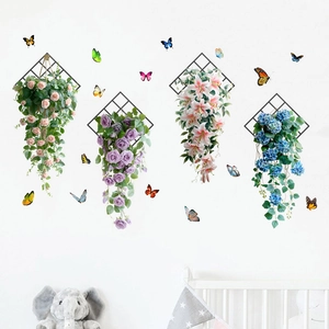 Detailed wall decor with pink roses, butterflies, and black diamond-shaped metal frames