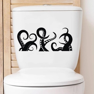 Waterproof black octopus tentacle stickers applied on a white ceramic toilet tank