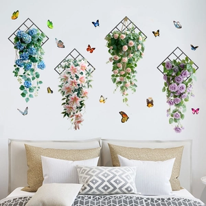 Close-up of floral wall decals featuring colorful roses and butterflies on metal grids