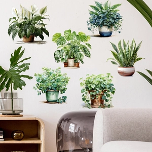 Detail of six hand-painted potted plant wall stickers in a cozy Nordic living room setup