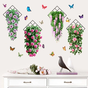 Hanging floral wall stickers with colorful butterflies on a white minimalist cabinet