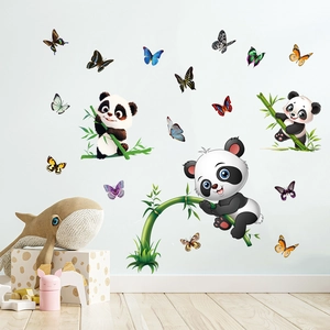 Detail view of cute panda and colorful butterfly wall decals in a warm children room