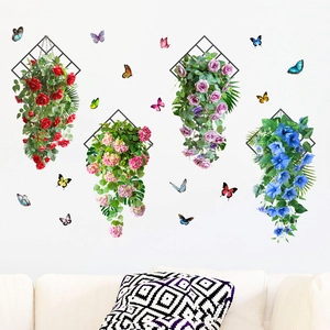 Detail view of colorful floral wall decals with butterflies above a sofa in a living room