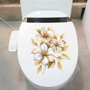 Detail view of 3D gold and white floral waterproof self-adhesive wall stickers on toilet lid