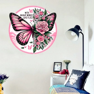 Detail of round wall sticker with pink flowers, butterfly wing and brave wings quote