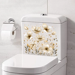 Close-up detail of hand-painted white floral stickers with gold accents on toilet tank