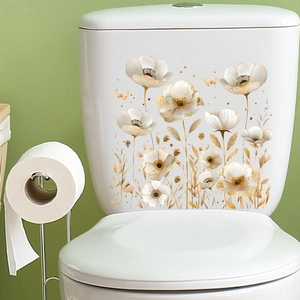 Detail showing gold butterfly and white floral waterproof stickers on bathroom toilet tank