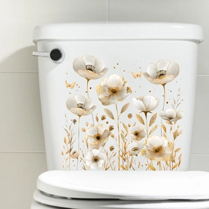 Detailed view of watercolor champagne gold flower and butterfly stickers on a toilet tank