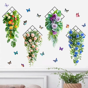 Detail of floral wall stickers with colorful butterflies and green leaves on white walls