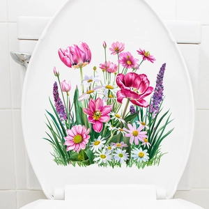Detail shot of self-adhesive tulip and daisy floral decals on a white bathroom toilet lid