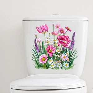 Detail showing self-adhesive tulip and daisy floral stickers applied on a white ceramic surface