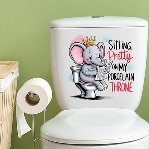 Detail of elephant reading newspaper sticker on toilet tank with porcelain throne text