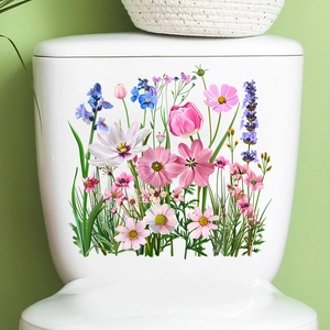 Detail of colorful waterproof tulip floral decals applied on a white ceramic toilet tank