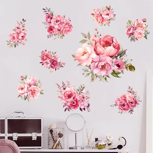 Détail de 9 stickers muraux de pivoines roses à l'aquarelle décorant un mur gris de chambre
