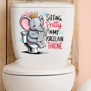 Detail showing elephant reading newspaper decal on white porcelain toilet tank