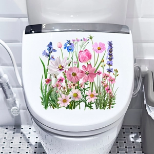 Detail showing self-adhesive tulip and wildflower decals on a modern white toilet lid