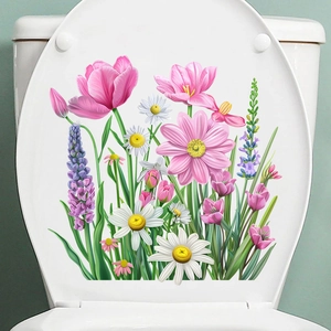 Detail view of pink tulip and daisy waterproof stickers applied to a white toilet lid
