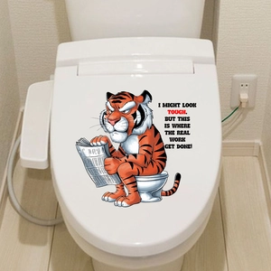 Detail of waterproof toilet sticker featuring a cartoon tiger reading a newspaper on white lid