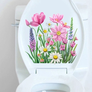 Detail of waterproof tulip and lavender flower decals on a clean white toilet lid
