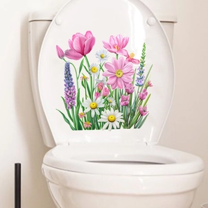 Detail view of colorful tulip and daisy waterproof stickers applied to a toilet lid