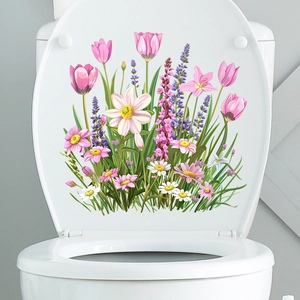 Detail of waterproof tulip and daisy self-adhesive stickers on a white toilet lid surface