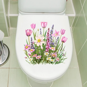 Detail of waterproof tulip and daisy self-adhesive flower stickers on a white toilet lid