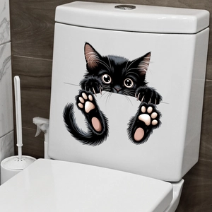 Detail of waterproof black peeping cat wall sticker on a white ceramic toilet tank