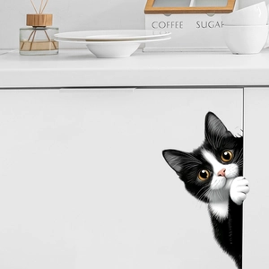 Funny black peeking cat wall sticker detail showing the 3D visual effect on a white cabinet