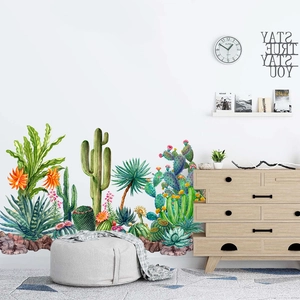 Watercolor cactus and succulent wall stickers applied to a modern living room white wall