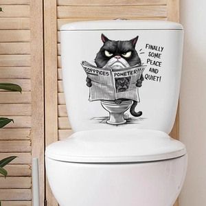 Close-up of a funny black cat reading a newspaper on a toilet waterproof wall sticker