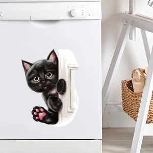 Detail of 3D black peeking cat wall sticker with pink paws on a white dishwasher