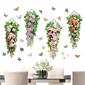 Detail of pink rose wall hangings with green leaves and 3D colorful butterfly stickers