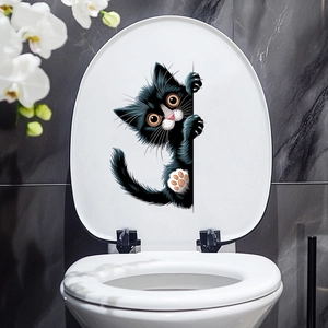 Detailed view of black 3D peeping cat sticker on a white toilet lid for bathroom decor