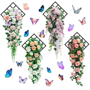 Detailed view of 3D rose and lily floral wall stickers with butterflies on black grids