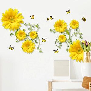 Detail of yellow daisy flower and butterfly wall decals on a clean white wall surface