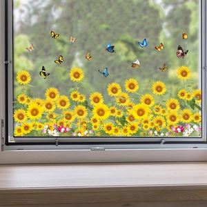 Detailed view of sunflower and butterfly wall decals applied on a window in a bright room