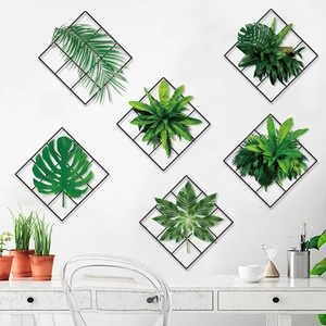 Detail of 6-piece metal diamond mesh wall art set with faux tropical greenery leaves