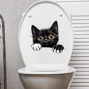 Funny black peeking cat wall sticker on a white toilet lid for creative home decoration