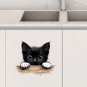 Detail showing a cute peeping cat waterproof sticker on a white modern kitchen cabinet door