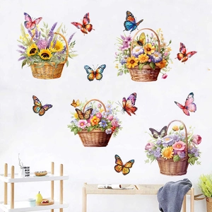 Detail of floral basket wall stickers with butterflies on a white wall in a cozy room