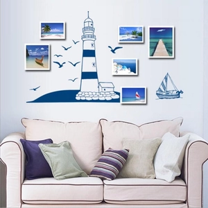 Mediterranean nautical wall stickers with lighthouse and sailboat in a living room setup
