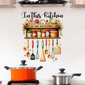 Detailed view of kitchen wall decal with cutlery and In This Kitchen text on tile