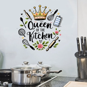 Detail view of Queen of the Kitchen wall sticker with golden crown and cooking utensils