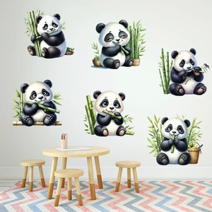 Detailed view of six cute cartoon panda wall decals in a cozy children's room setting