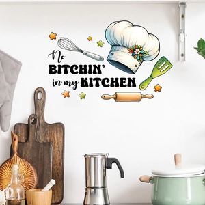 Detail of kitchen wall decal with funny slogan and cooking tools on white wall
