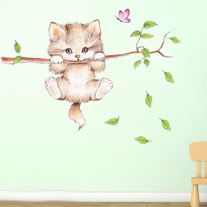 Detail of 3D cute cat wall sticker with leaves and butterfly on green wall