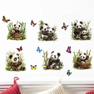 Detail of cute panda and bamboo wall stickers with butterflies on white interior wall