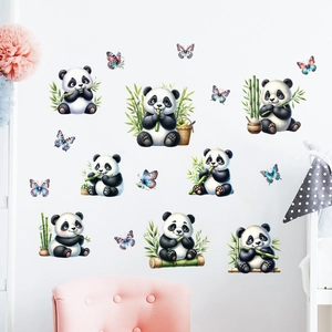 Detail of cute panda and butterfly wall stickers applied on a white nursery room wall