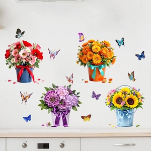 Detail of waterproof sunflower and butterfly wall stickers on a clean white kitchen wall
